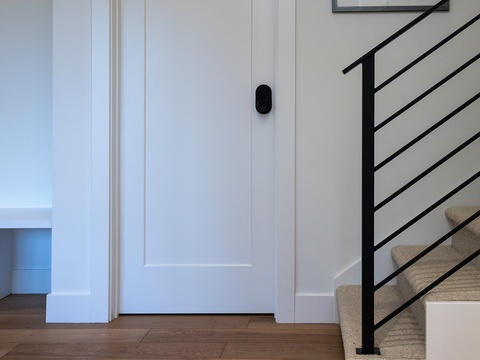 Modern, minimal design with sleek staircase and warm wood floors invites you to explore your multi-level retreat.