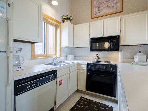 Your fully equipped kitchen features everything needed to prepare meals during your stay, with bright natural light and ample counter space for cooking and gathering.