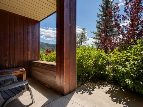 Step onto your private balcony and breathe in the fresh mountain air while soaking in stunning views of lush greenery and distant peaks—your perfect retreat awaits.