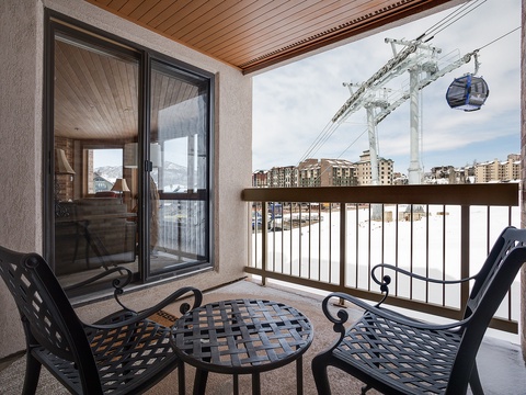 Step onto your private balcony and take in the stunning mountain and gondola views. Relax in comfortable seating with direct access to ski slopes, making this your perfect alpine retreat.
