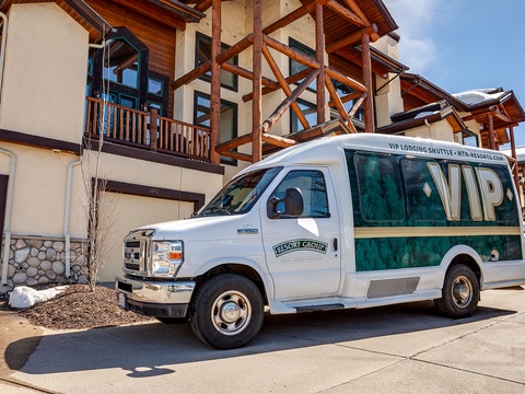 VIP shuttle service awaits at this alpine-style property entrance, offering seamless transportation to nearby mountain attractions and amenities during your winter getaway.
