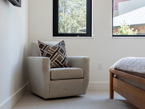 Your private corner awaits—soft natural light, a cozy reading chair, and peaceful views just outside your window for those quiet mornings or restful evenings.