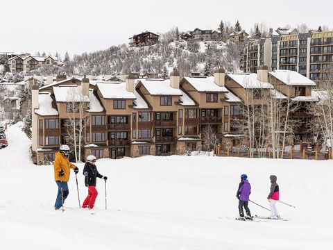 Ski-in/ski-out property with slopeside access, nestled in a winter mountain village surrounded by stunning alpine scenery and fresh powder.