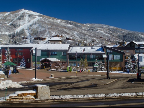 Winter mountain town with snow-covered peaks and colorful buildings near the property, offering a scenic alpine setting for ski season adventures.