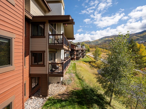 The property nestled in a peaceful mountain community with stunning valley and hillside views, offering a serene backdrop and easy access to natural surroundings.