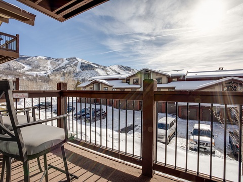 Snow-covered ski slopes frame this peaceful winter retreat, located steps from the lifts and surrounded by mountain-village charm.