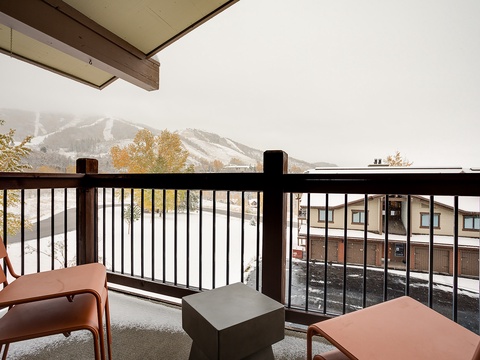 Step out to your private covered balcony and take in peaceful views of the slopes, framed by autumn foliage and mountain peaks—perfect for morning coffee or evening relaxation.