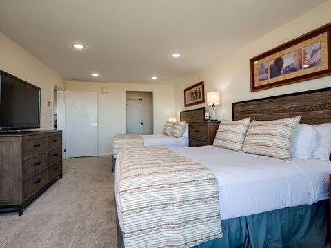 Sink into plush beds adorned with soft linens, perfect for unwinding after a day of adventure. Your restful retreat features warm coastal decor and all the comforts of home.