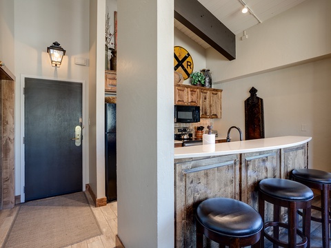 Step into your welcoming retreat, where rustic charm meets modern comfort. Gather at the beautifully crafted breakfast bar with seating for everyone, while soaking in unique décor that makes this space feel like home.