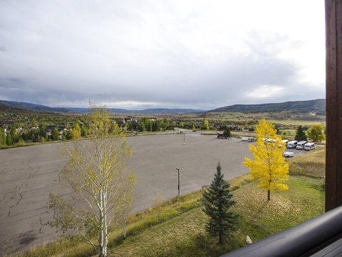 Sweeping views of rolling mountains and autumn foliage frame this peaceful valley setting, with convenient parking just outside the property.