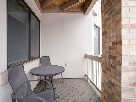 Your private outdoor space with exposed beam ceiling and brick details. Perfect for morning coffee or unwinding after exploring the area.