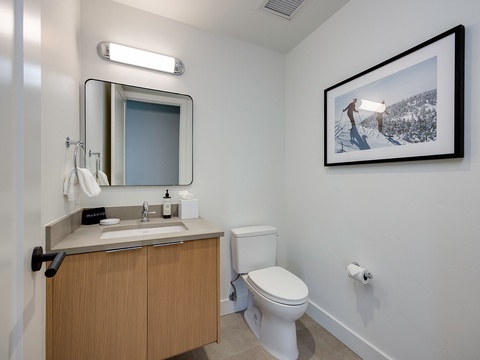 A bright, modern bathroom awaits with a sleek vanity, fresh linens, and crisp lighting to start your day refreshed.