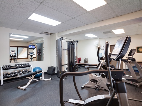 Your fully equipped fitness center awaits with cardio machines, free weights, and cable systems—perfect for maintaining your workout routine while away from home.