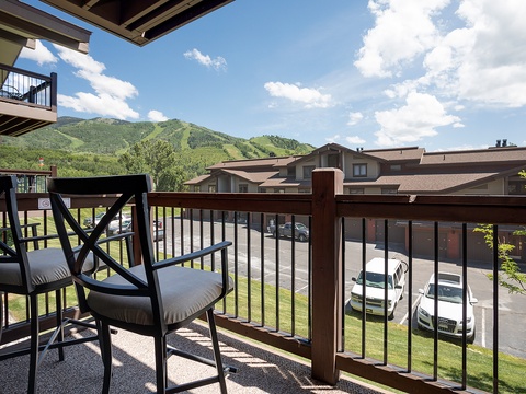 Step onto your private balcony and soak in stunning mountain views. Two chairs await for morning coffee or evening relaxation as you gaze at the scenic slopes.