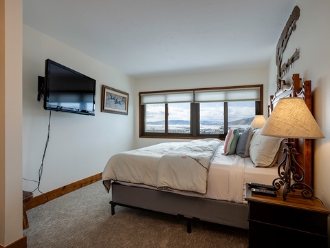 Wake up to breathtaking mountain views from your cozy bedroom. Drift off beneath crisp linens, unwind with your favorite shows, and feel perfectly at home in this inviting space.