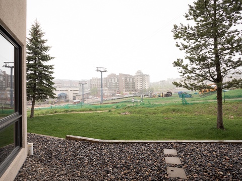 The property offers a peaceful setting with open green spaces and mountain scenery, located near a developing ski resort area with convenient lift access.