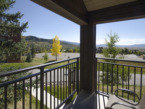 Step onto your private balcony and take in sweeping mountain and valley vistas framed by evergreens and open skies—a peaceful retreat awaits you.