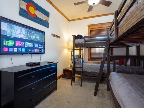 Your perfect family retreat features sturdy bunk beds with plush bedding, a smart TV for entertainment, and a ceiling fan to keep you comfortable year-round.