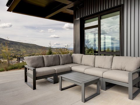 Sink into plush seating on your covered terrace and soak in the stunning mountain vistas stretching before you—your perfect spot for morning coffee or evening relaxation.