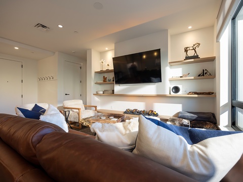 Sink into plush seating and let natural light fill your retreat. This inviting space blends warm textures, stylish décor, and modern comforts to help you truly unwind.