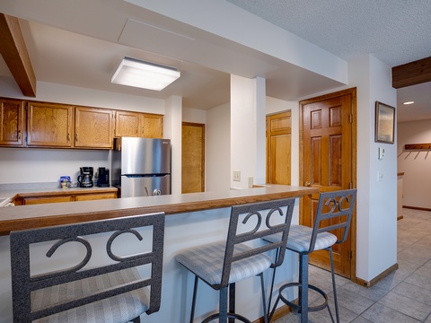 Settle into your fully equipped kitchen with breakfast bar seating, modern appliances, and plenty of cabinet space—perfect for preparing meals and gathering with loved ones.