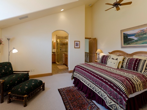Slip into your spacious bedroom retreat, where vaulted ceilings and mountain-inspired decor set the stage for restful nights and peaceful mornings.