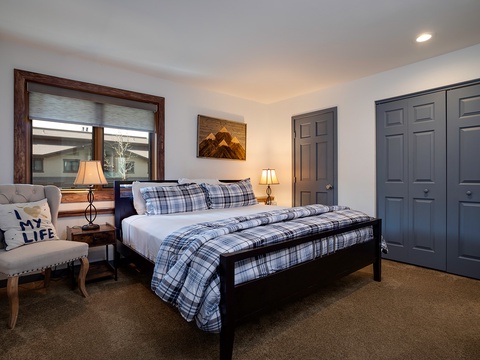 Sink into plush bedding and unwind in your cozy retreat, where warm lighting, thoughtful furnishings, and mountain-inspired décor create the perfect space for restful nights.