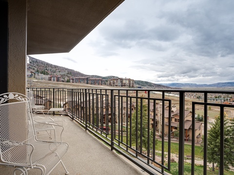 Spacious private balcony with sweeping mountain and valley views—perfect for morning coffee or evening relaxation as you take in the expansive landscape.