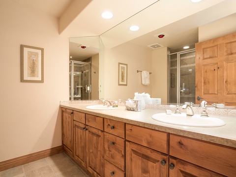 Unwind in your spacious bathroom with dual sinks, custom cabinetry, and a luxurious walk-in shower—everything you need for a refreshing start to your day.