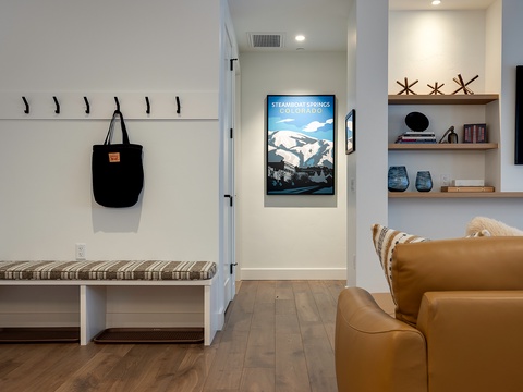 Step into your home away from home where coastal touches and open shelving create a welcoming space to unwind after your mountain adventures.
