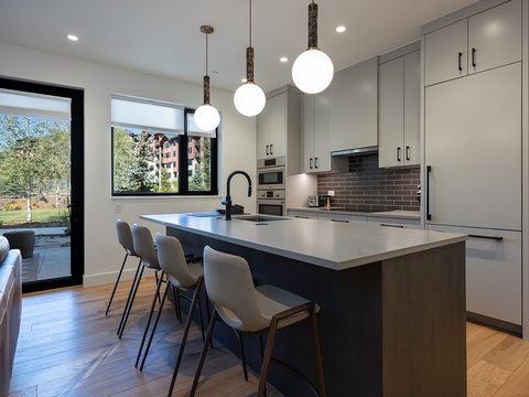 Step into your sleek, modern kitchen with ample counter space, gleaming appliances, and a spacious island perfect for cooking and gathering with friends and family.