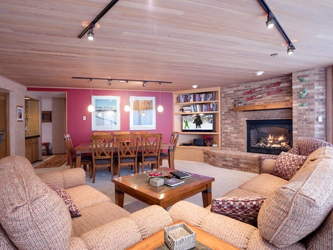 Unwind in your spacious living area with cozy seating, a warm fireplace, and open layout that invites conversation and relaxation after a day of adventure.