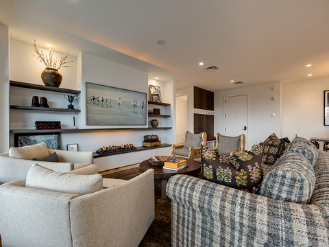 Unwind in your stylish living room, where plush seating, warm lighting, and thoughtful design invite you to relax and make yourself at home.