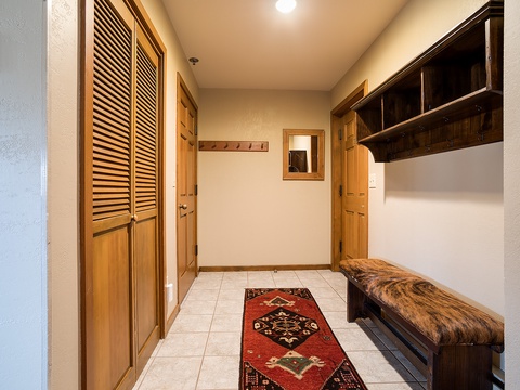 Step into your welcoming entryway with rich wood finishes, convenient bench seating, coat hooks, and charming decor—everything you need to settle in and feel at home from the moment you arrive.