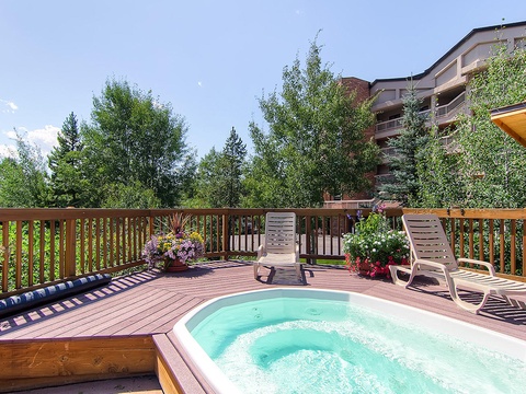 Imagine soaking away your cares in this bubbling hot tub, surrounded by fresh mountain air, vibrant flowers, and the gentle rustling of aspen trees above your private deck.