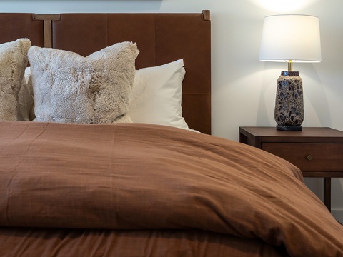 Sink into plush bedding and fluffy pillows after your day of adventure. Warm wood tones and thoughtful touches create your peaceful retreat.