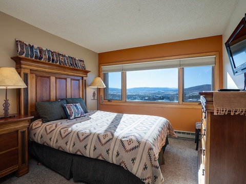 Wake up to breathtaking mountain vistas framed by your window, where valleys and distant peaks greet you each morning in this cozy retreat.