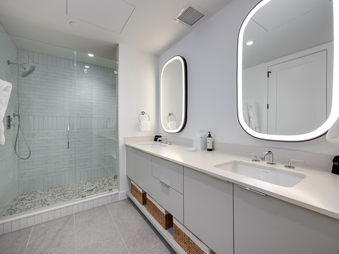 Step into your spa-like bathroom retreat, where soft lighting and sleek design create the perfect place to unwind after exploring the day's adventures.