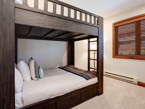 Cozy sleeping arrangements perfect for kids or guests, with a sturdy bunk bed that maximizes space while keeping everyone comfortable.