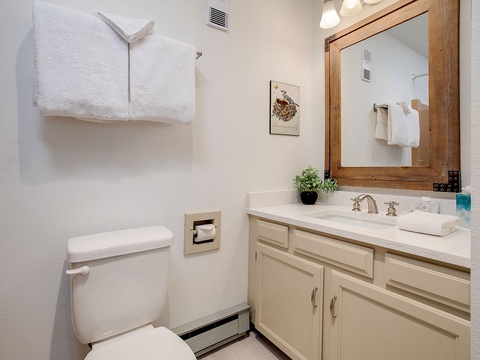 Step into your private bathroom with fresh linens, a pristine vanity, and charming rustic details that make your morning routine feel like a retreat.