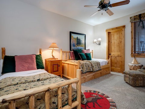 Unwind in your cozy mountain retreat with rustic log furnishings, plush bedding, and inviting touches that make you feel right at home after a day of adventure.