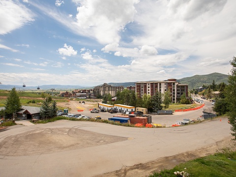 Mountain resort area with easy access to gondola lifts, shops, and nearby attractions in a scenic alpine setting.
