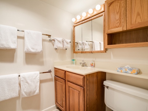 Freshen up in your private bathroom with vanity lighting, fresh towels, and all the essentials you need to feel right at home.