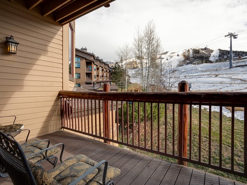 Step onto your private deck and breathe in the fresh mountain air. Lounge in the cozy seating while taking in snowy ski slopes and scenic alpine views right from your balcony.