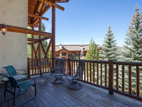 This private balcony offers peaceful outdoor seating where you can unwind with mountain breezes and wooded views, perfect for morning coffee or evening relaxation.