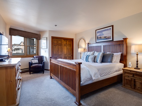 Slip into crisp linens and sink into plush pillows on your king-sized bed, with warm wood accents and mountain views welcoming you to unwind.