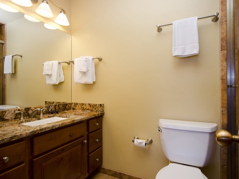 Your private bathroom features a granite vanity, fresh towels, and thoughtful amenities to help you start and end each day feeling refreshed.