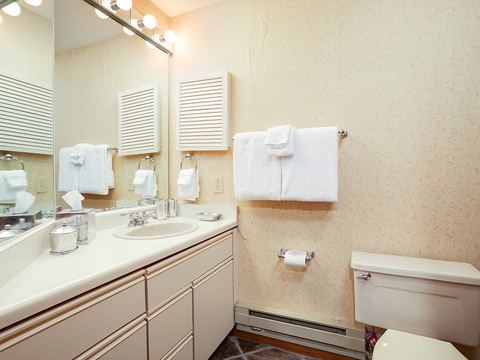 Your private bathroom offers everything you need to feel at home, with fresh towels, a vanity with storage, and a bright, clean space perfect for unwinding after a day of exploring.