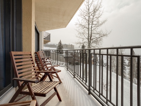 A private balcony with snowy mountain views offers the perfect spot to sip your morning coffee while taking in the winter landscape and crisp alpine air.