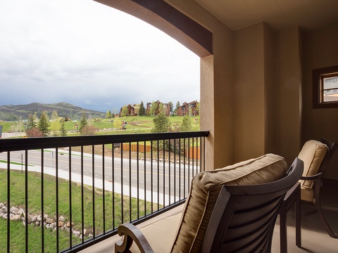 Sink into your private balcony chair and let the fresh mountain air wash over you. Overlooking lush greens and rolling hills, this peaceful retreat invites you to sip your morning coffee or unwind after a day exploring.